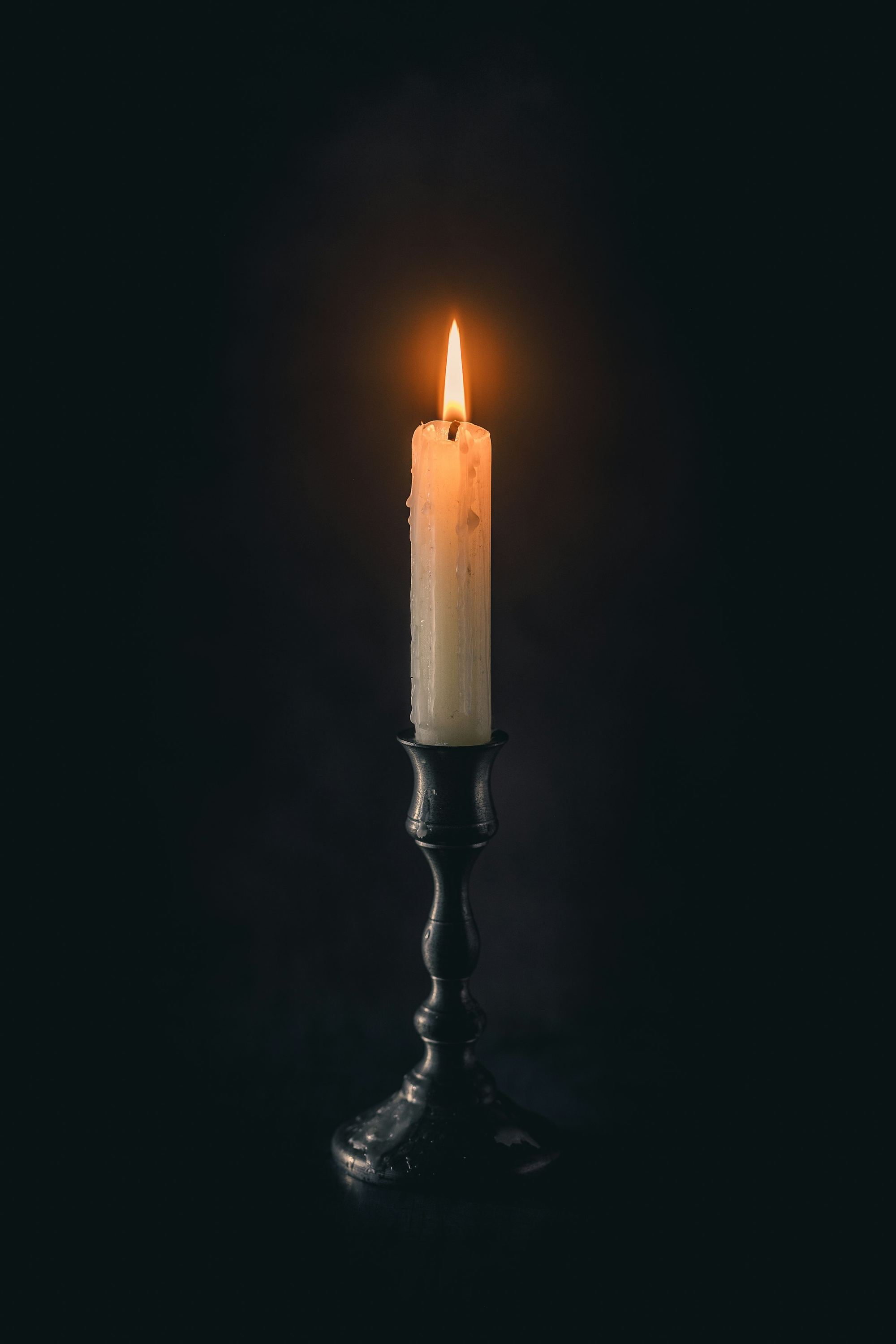 A single flame in the dark